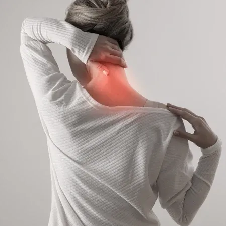 Person holding neck with red highlight showing neck pain.